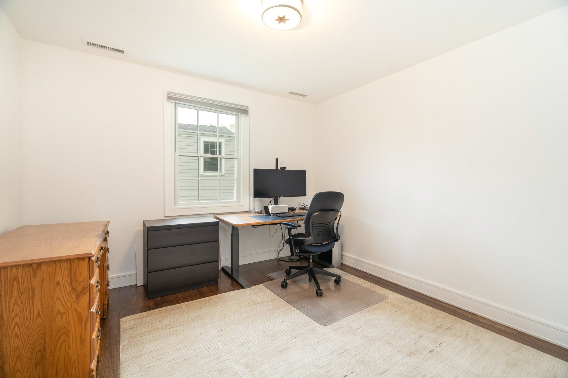 Third bedroom set up as a home office with standing desk