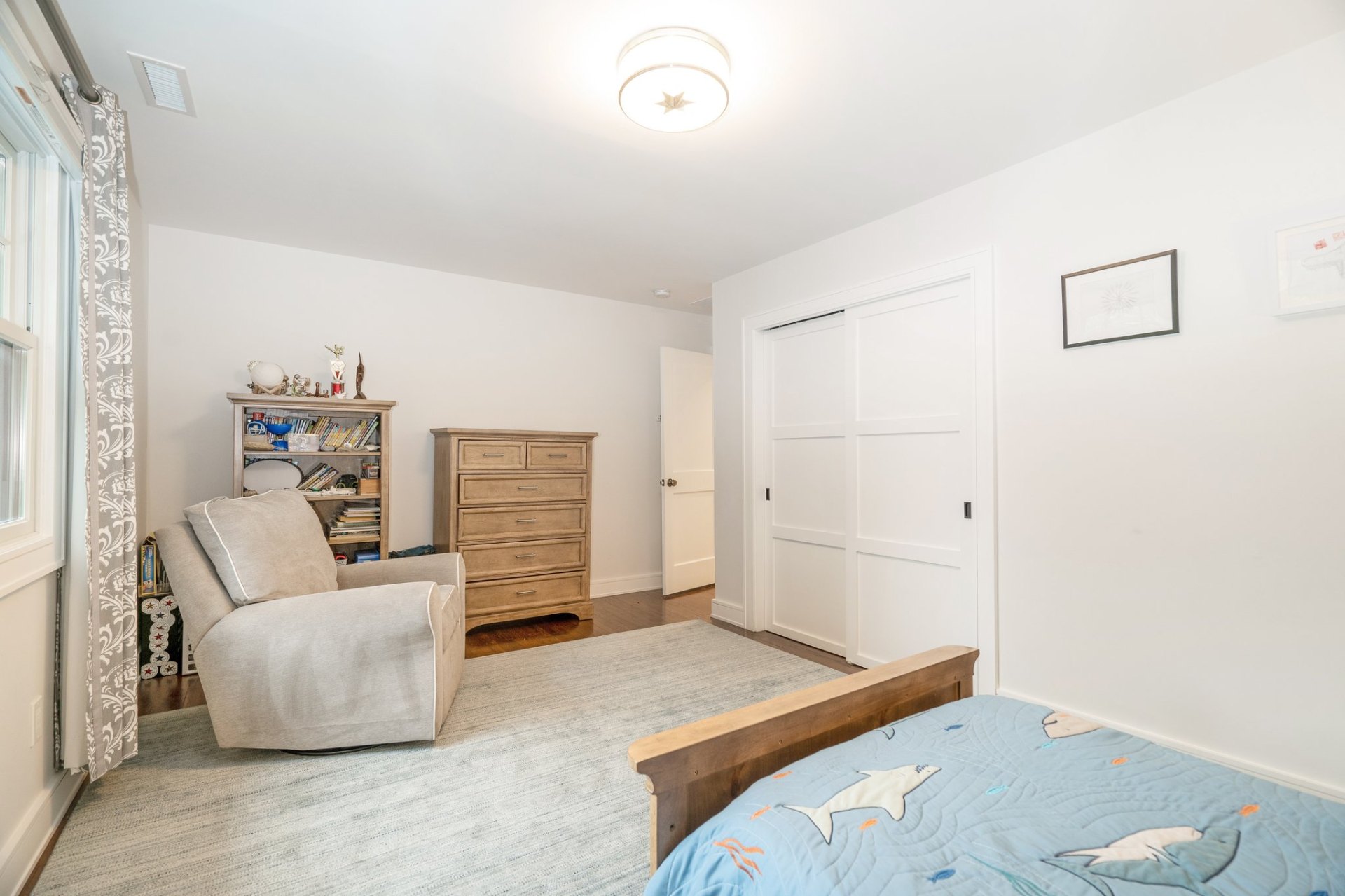 Spacious fourth bedroom with reading nook