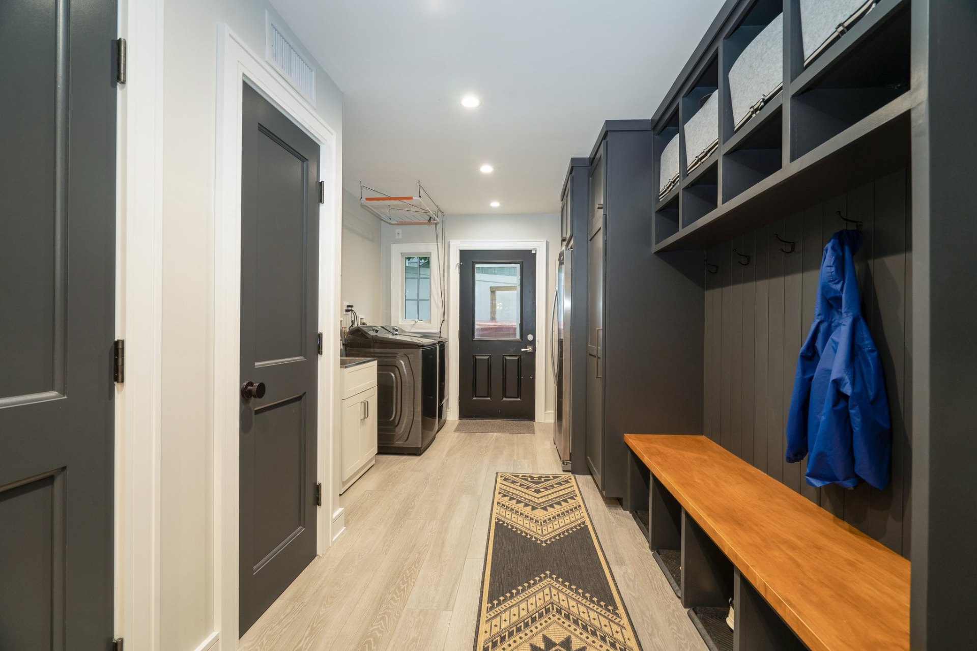 Organized mudroom with built-in storage and laundry