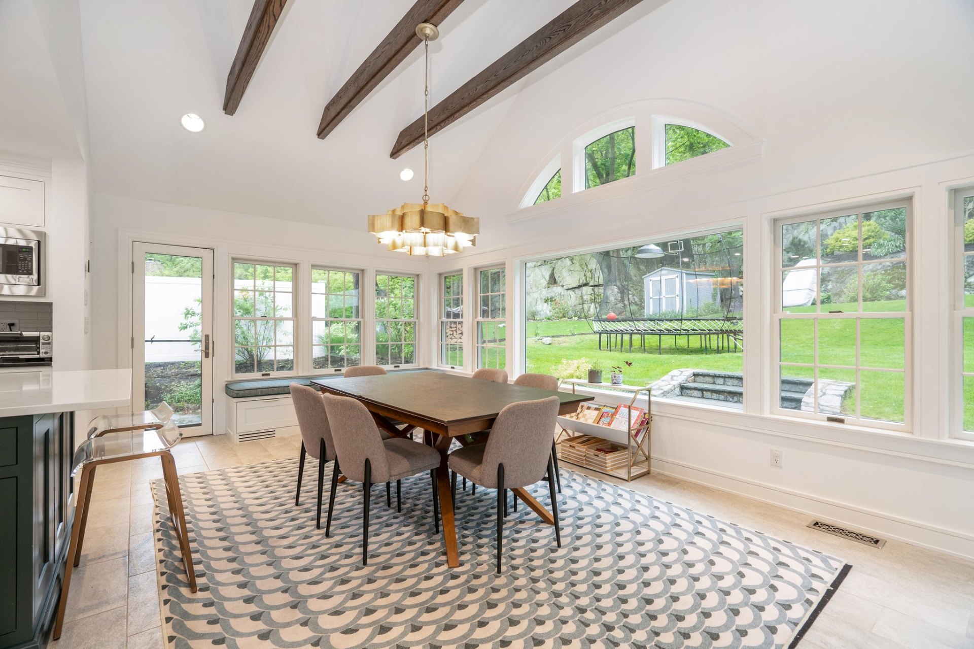 Sunlit rear dining room with garden views